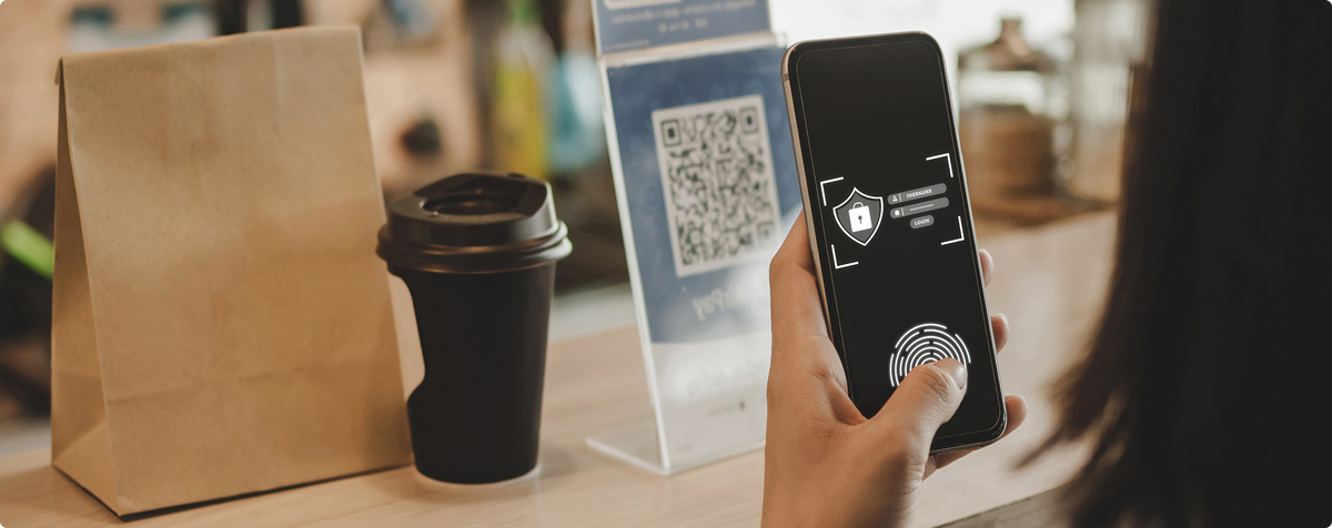 Person scanning QR code on smart food packaging with smartphone