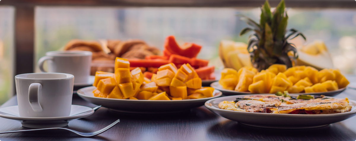 Colorful fresh fruit platter with mango, papaya and pineapple for healthy snacking