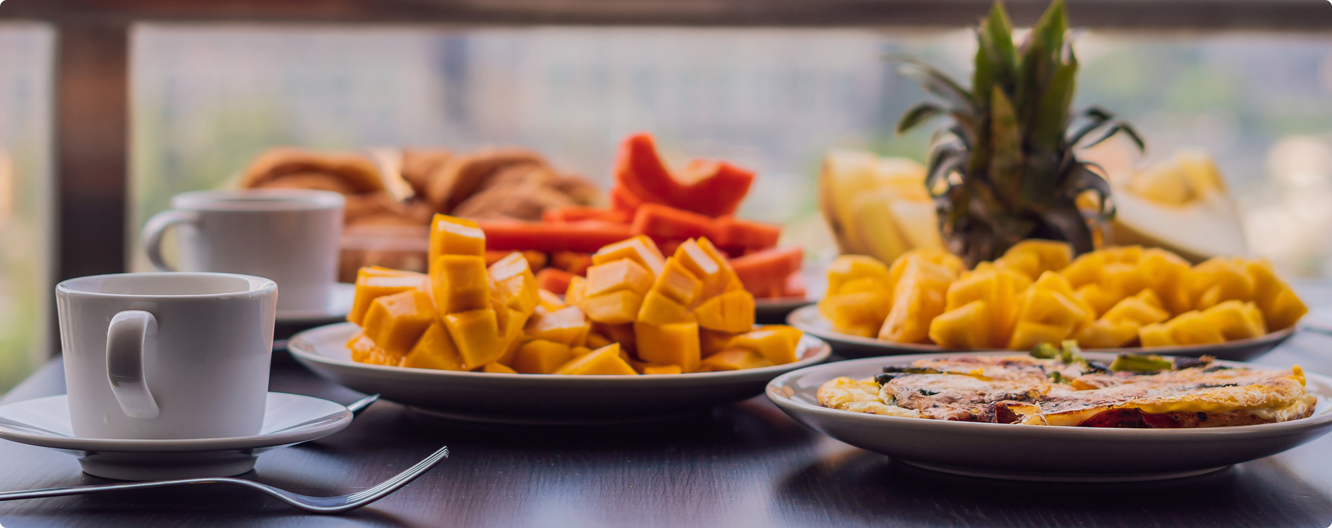 Colorful fresh fruit platter with mango, papaya and pineapple for healthy snacking